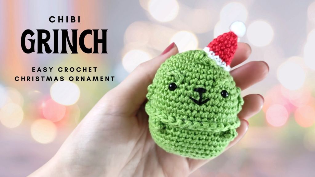 mini chibi grinch crochet doll with a red christmas hat